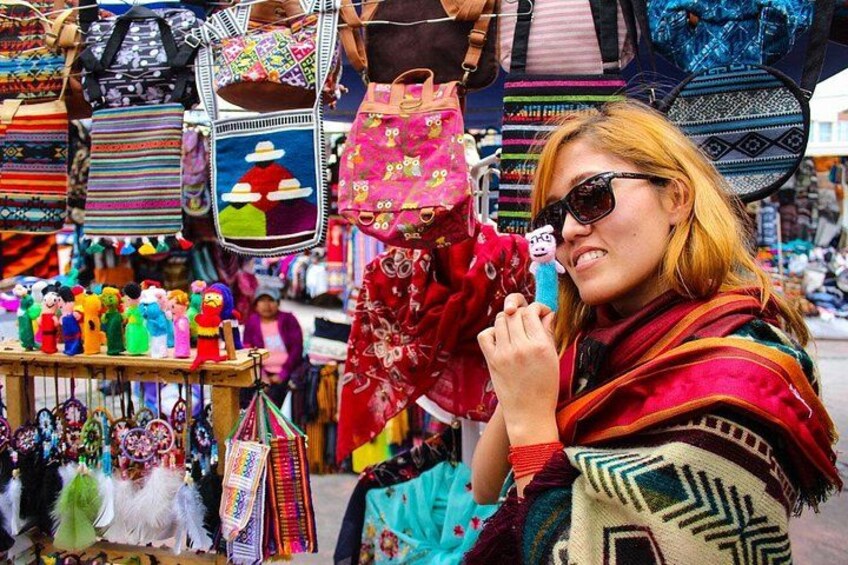 A market stall with colorful bags and accessories. 2