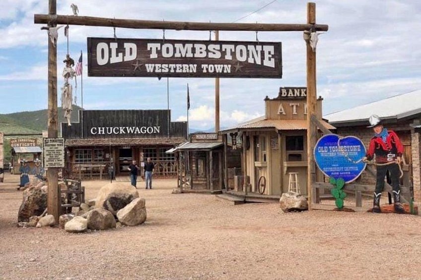 A Western-themed town with a sign reading 'Old Tombstone Western Town,' a Chuckwagon, a bank, and a saloon. 1