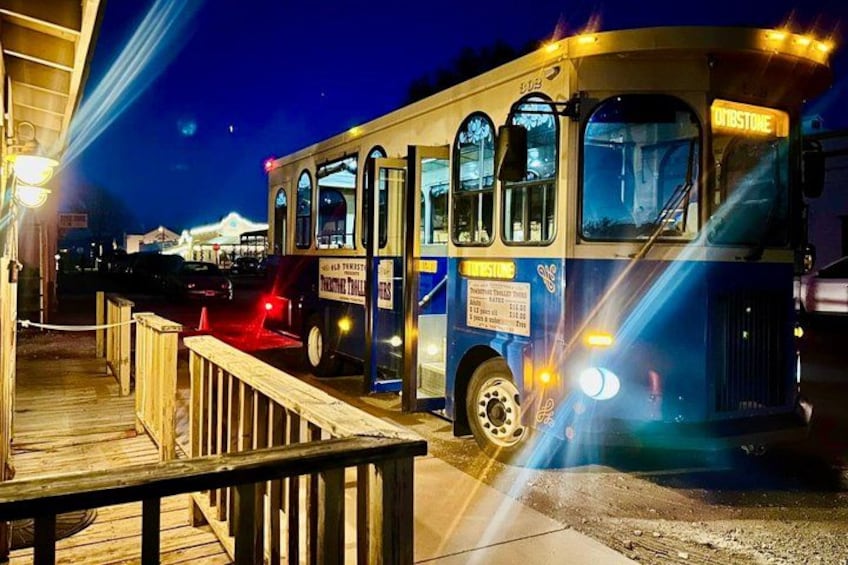 A bus parked at a wooden dock with a sign that reads 'Offshore.' 5