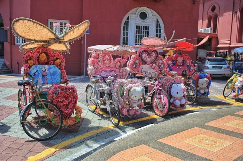 A street with decorated bicycles and a building in the background. 3