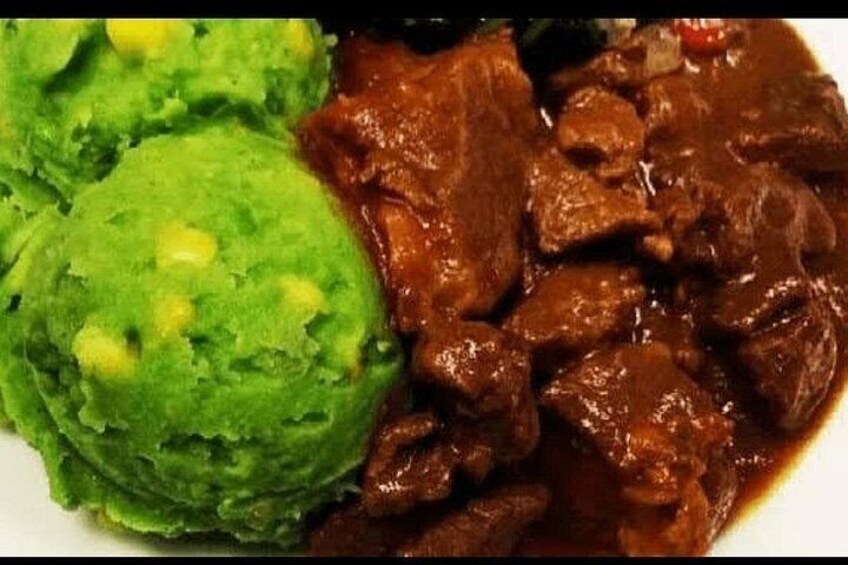 A plate with mashed potatoes and a meat dish. 3