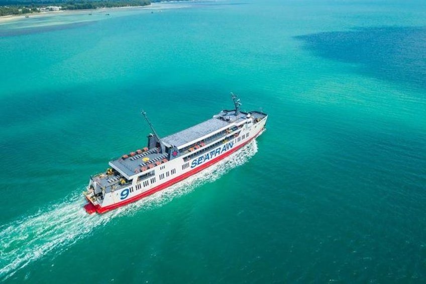 A large cruise ship with the number 9 and the name 'SEVAN' sailing in turquoise waters. 4