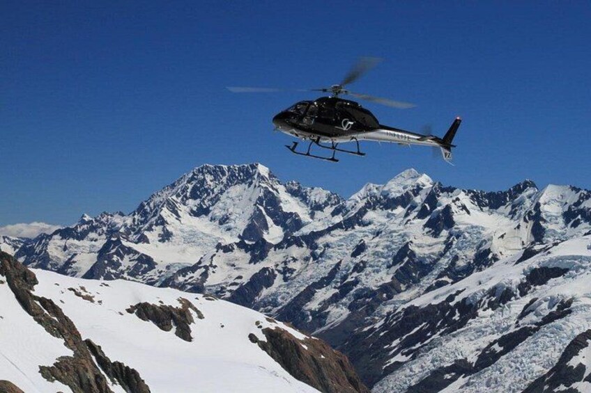 Helicopter flying over the Southern Alps 1
