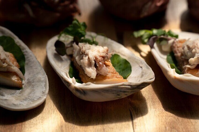 Three oysters on a wooden table. 5