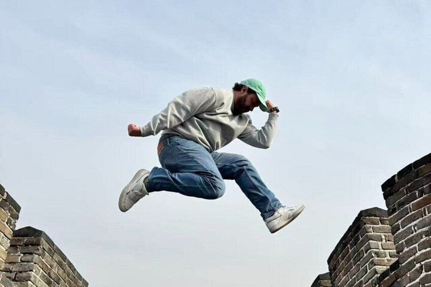 A person jumping between two brick walls. 5