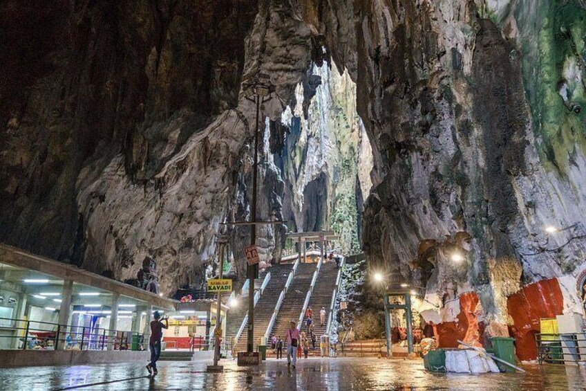 A cave with stalactites, a staircase, and a glass viewing area. 2