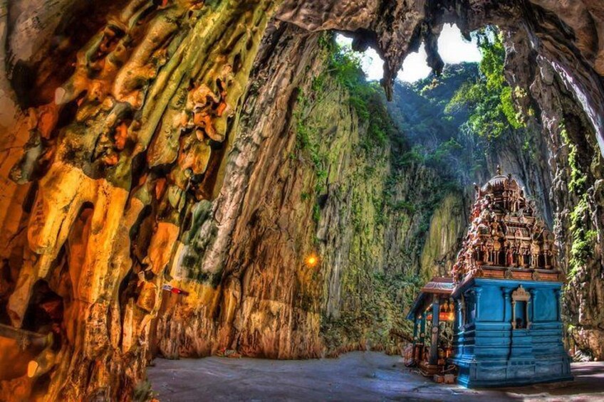 A cave with a temple structure inside. 5