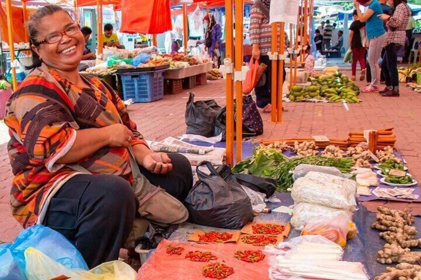A market with various vegetables and fruits laid out on tables. 2