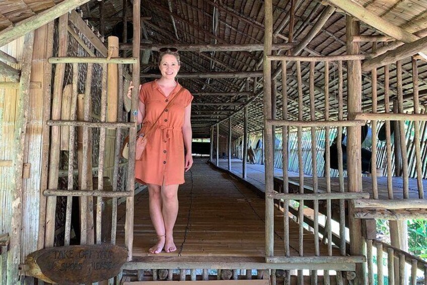 A wooden structure with a person standing in the doorway. 2