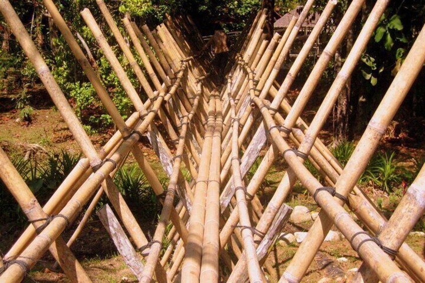 A bamboo structure in a garden. 2
