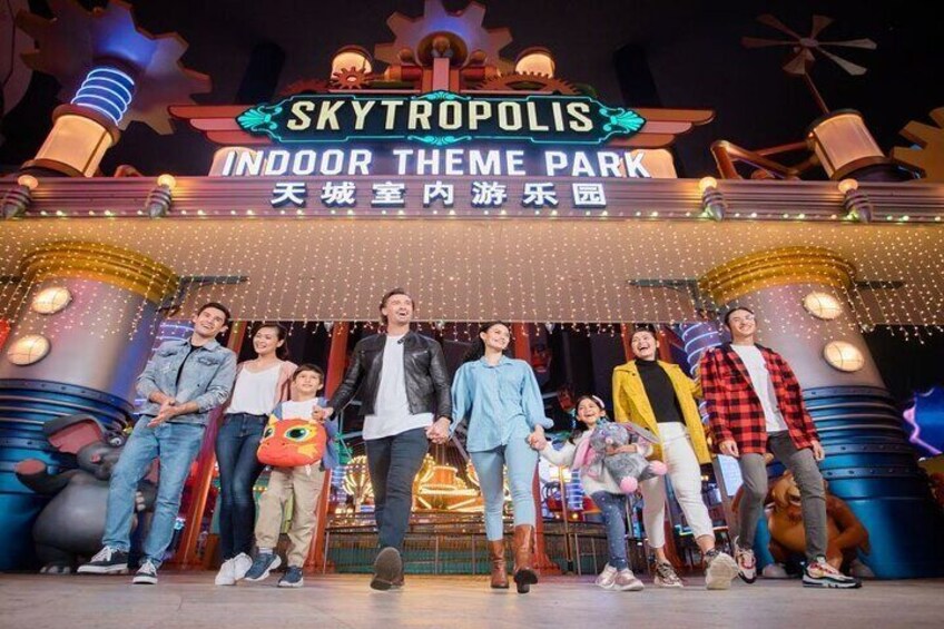 A group of people at the entrance of SkyTropolis Indoor Theme Park. 4