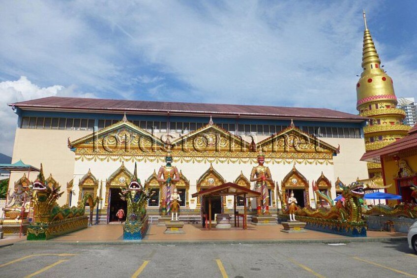 A temple with ornate architecture and a golden spire. 2