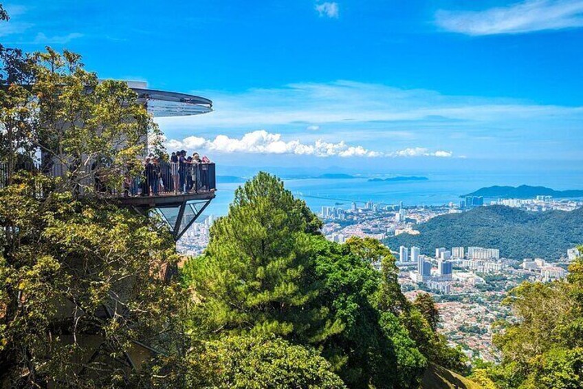 A high vantage point overlooking a city with a clear view of the coastline. 4