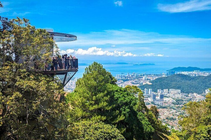 A high vantage point overlooking a city with a clear view of the coastline. 2