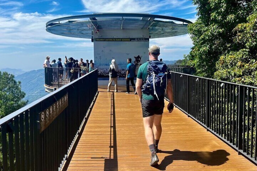 A wooden walkway with a glass viewing platform. 1