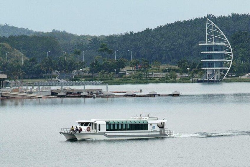 A river with a boat, a modern bridge, and a forested hill in the background. 3