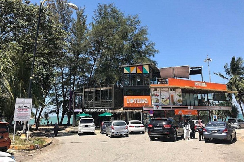 A multi-story building with a Starbucks and a Loteng restaurant. 2