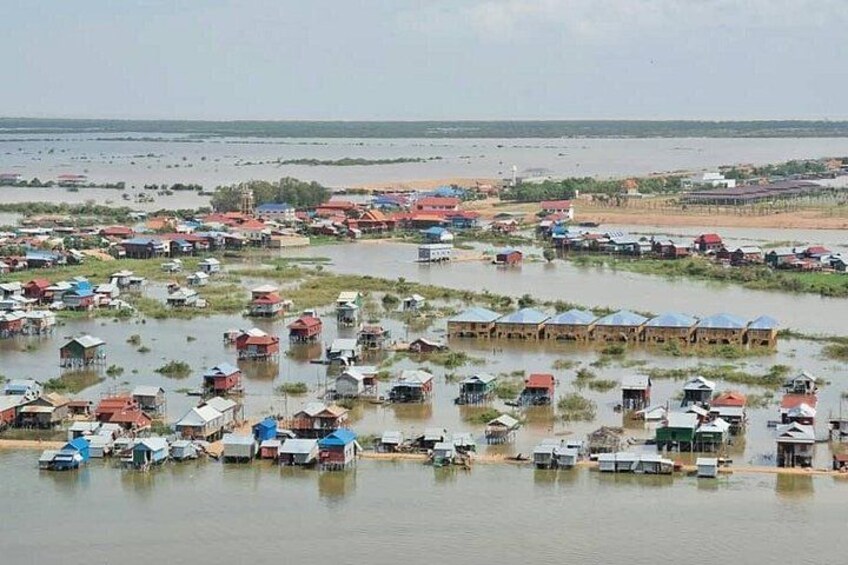 A flooded village with houses partially submerged in water. 4