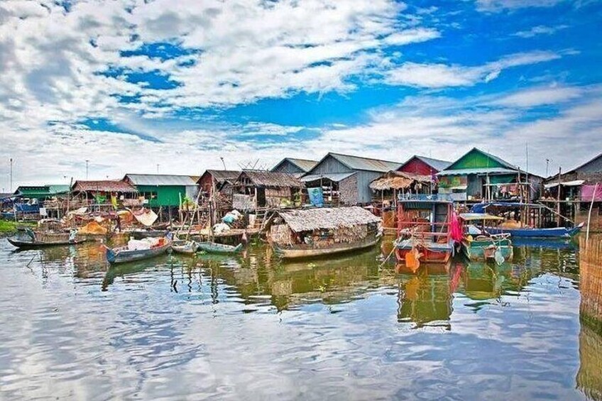 A waterway with floating houses and boats. 4