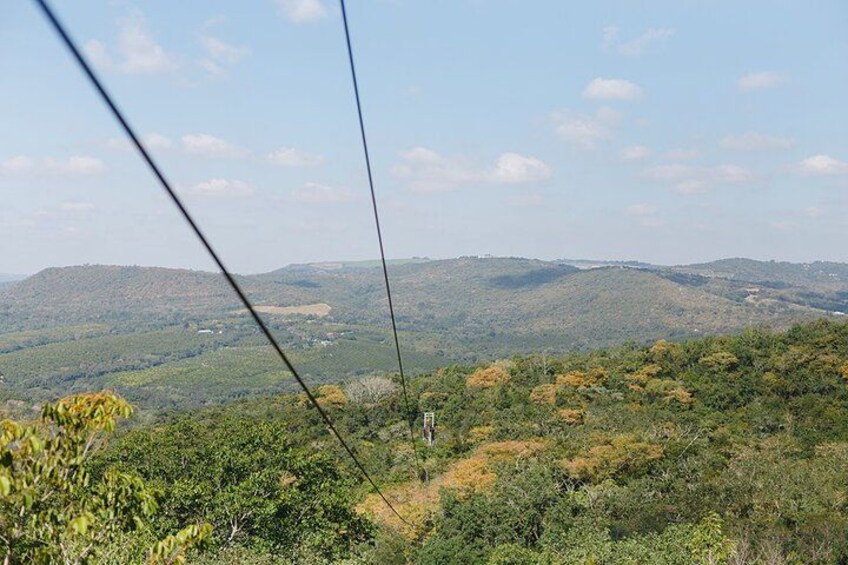 A cable car system with a mountainous landscape in the background. 1
