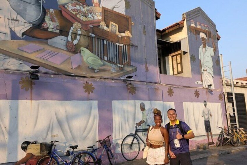 A mural on a building with bicycles parked in front. 5