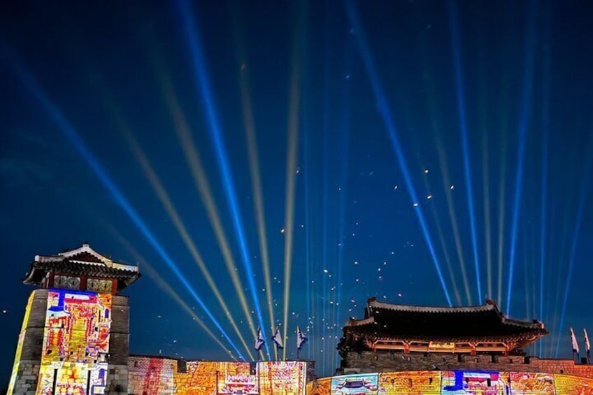 A traditional building with illuminated beams and colorful signage. 3