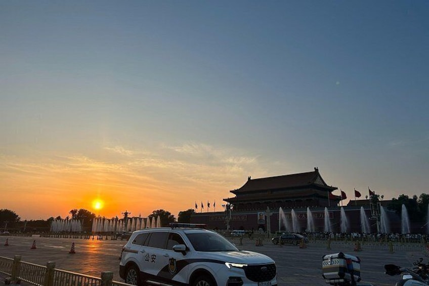 A sunset, a traditional building, and a police SUV. 4