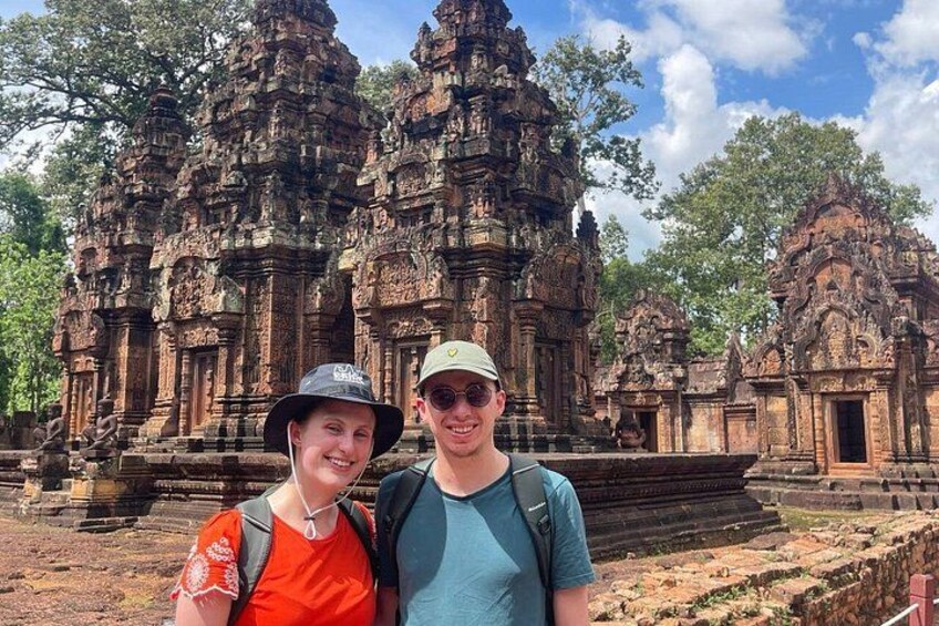 A couple standing in front of ancient stone architecture. 3