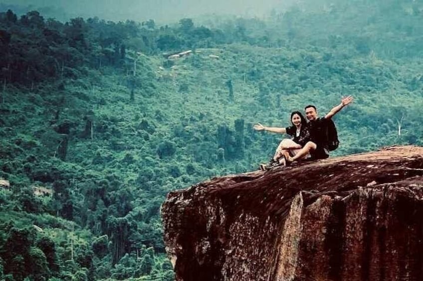 The image of a happy couple on the rock valley on Kulen Waterfall tour 4