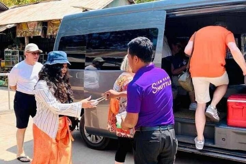 A free cold bottle of water and face towel are provided on the tour of Kulen Waterfall tour 2