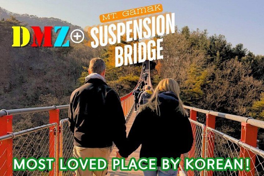 A suspension bridge with people walking on it, surrounded by trees and hills. 5