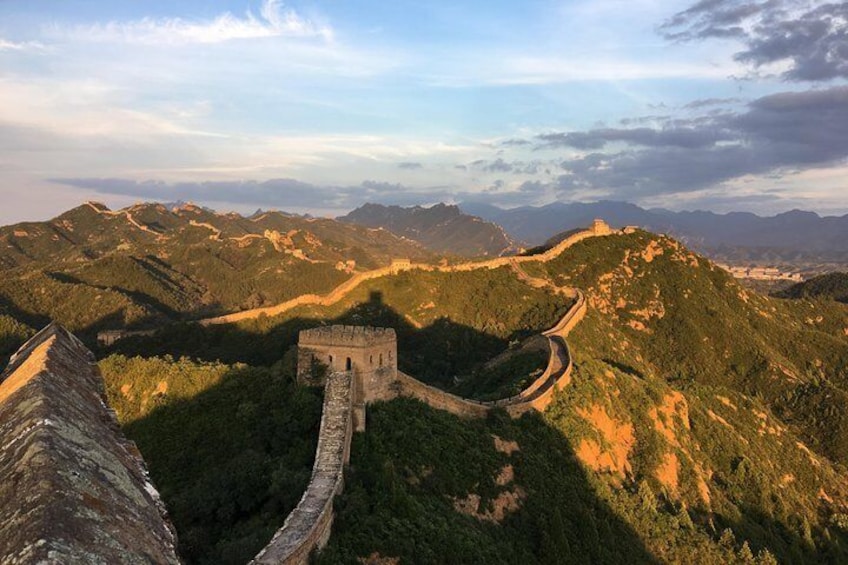 The Great Wall of China winding through mountainous terrain. 5
