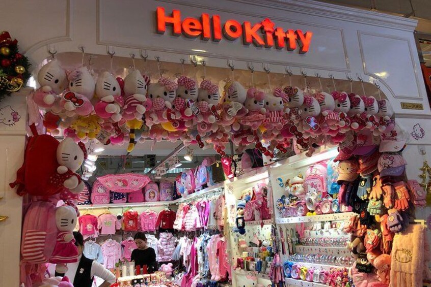A Hello Kitty themed store with plush toys and merchandise. 2
