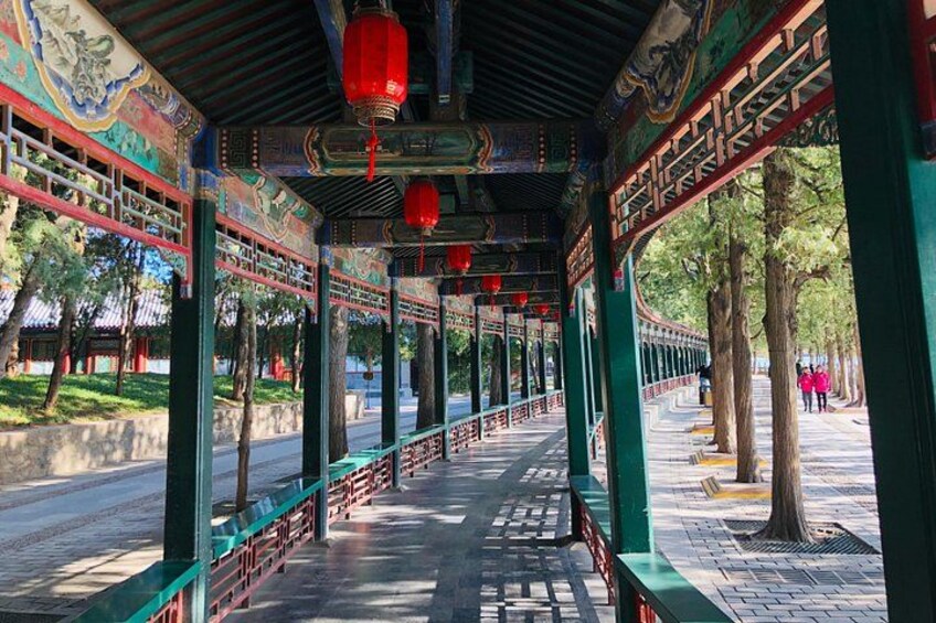 A traditional Chinese pavilion with ornate decorations and red lanterns. 2