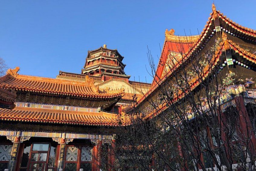 A traditional Chinese building with ornate architecture, including a pagoda and intricate roof designs. 3