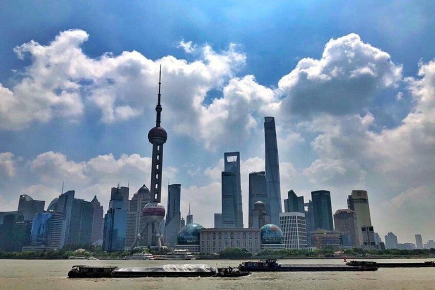 A city skyline with prominent skyscrapers and a tower with a spherical observation deck. 5