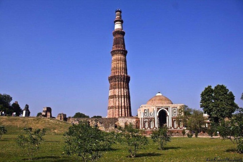 The Qutub Minar, a historic tower, and the adjacent Jama Masjid in Delhi. 2