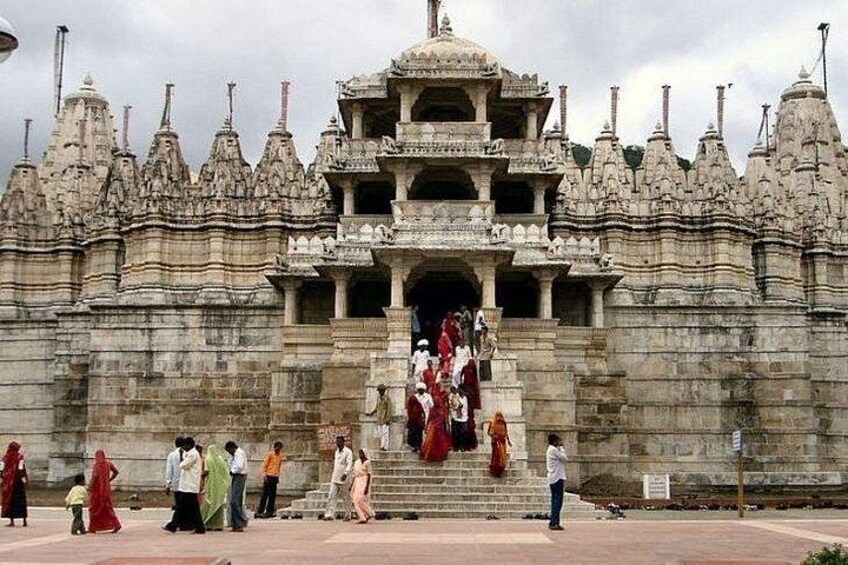 A large stone temple with intricate carvings and multiple spires. 3