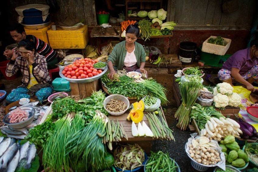 A market stall with various vegetables and fruits. 2