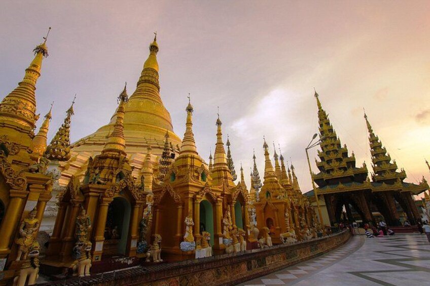 A row of golden pagodas with intricate designs and multiple tiers. 2