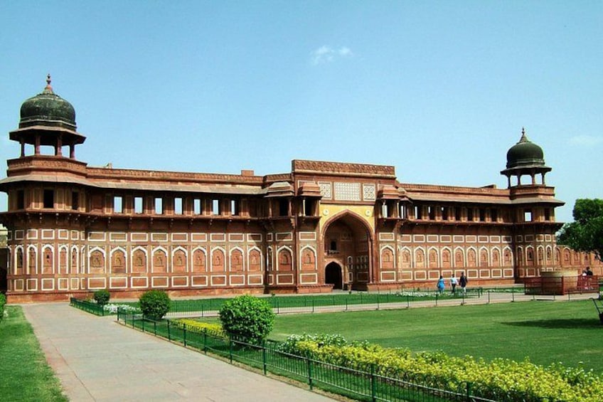 A large, historic building with domed towers and intricate architecture. 2