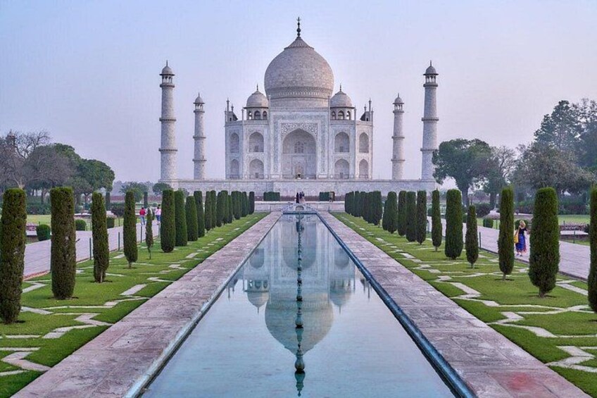 The Taj Mahal with a central reflecting pool and symmetrical gardens. 4