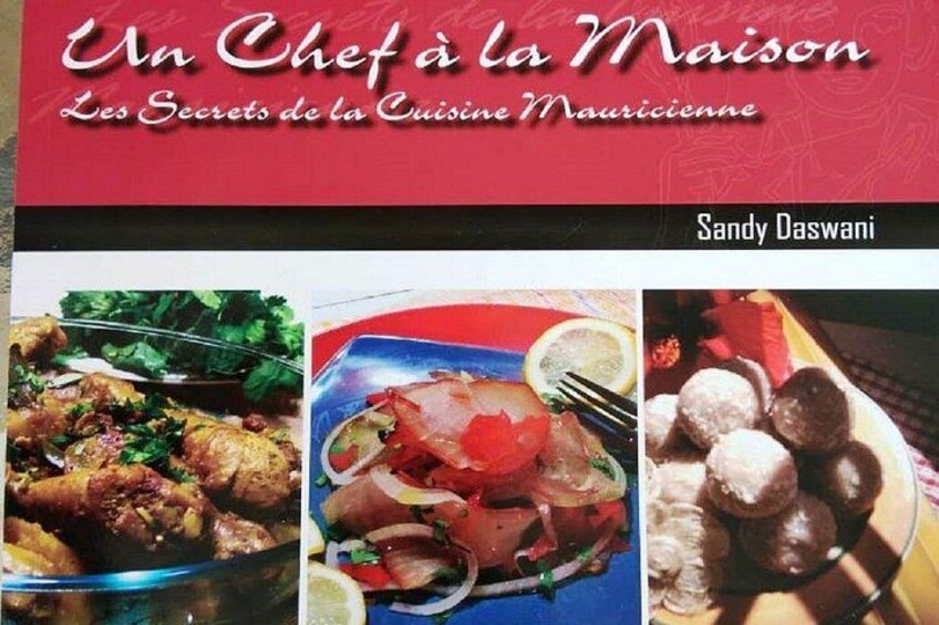 A book cover titled 'Un Chef à la Maison' by Sandy Daswani, featuring images of various dishes. 5