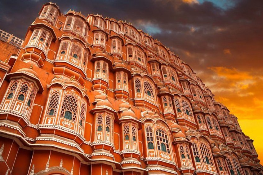A large, ornate building with intricate architectural details and multiple windows. 4