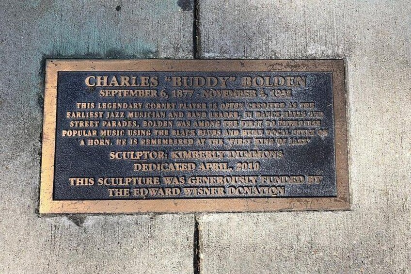 A commemorative plaque dedicated to Charles 'Buddy' Bolden, a cornet player, with historical details and a dedication date. 2