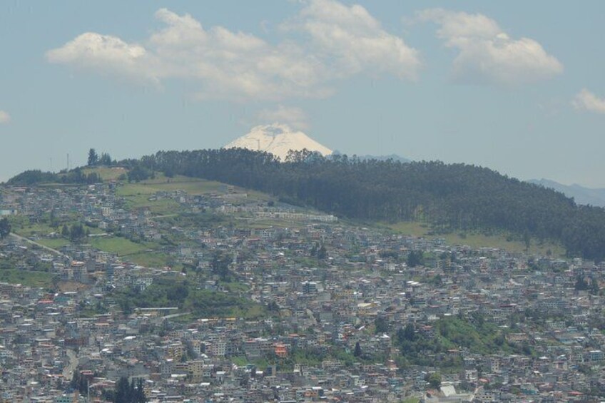 A cityscape with a mountain in the background. 2