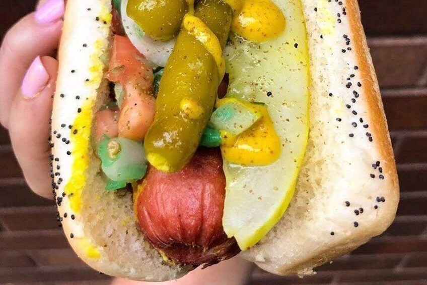 It all starts with the poppy seed bun—soft, warm, and packed with flavor. It’s the golden throne for Chicago’s iconic hot dog, served with pride on our Chicago Food Tours & Food Tours in Chicago. 3