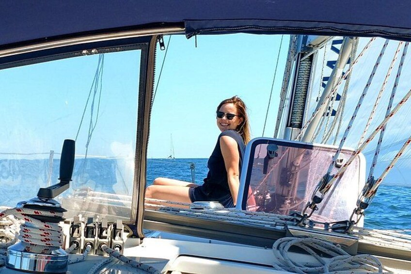 Sitting on the foredeck taking in a relaxing sail. 3
