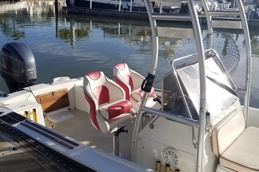 boat with cushioned seating and shade from a T-top 2