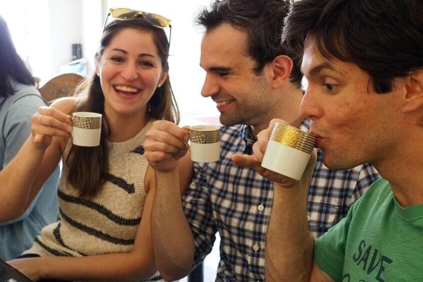 A group of people holding mugs. 5